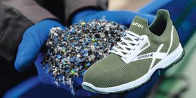 Dreifach grüner Arbeitsschuh